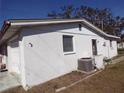 Exterior view of a white house at 5033 Tammy Ln, Holiday, FL 34690