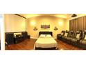Cozy bedroom setup with a Murphy bed, projector, and cinema seating, perfect for movie nights at 1421 Apollo Beach Blvd, Apollo Beach, FL 33572