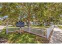 Historical marker in front of a classic building with a white picket fence at 1888 Douglas Ave, Dunedin, FL 34698