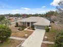 Spacious home featuring a large driveway, manicured front yard, and a well-maintained roof in a neighborhood at 6112 Kinlock Ave, Spring Hill, FL 34608