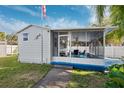 A cozy screened porch area perfect for relaxation at 7256 Westwind St, Weeki Wachee, FL 34607