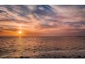 Beautiful waterfront sunset reflecting on the water at 1723 Gulf Rd # 104, Tarpon Springs, FL 34689