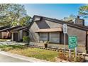 Brown exterior with white brick accents and well-manicured landscaping creates a welcoming atmosphere at 2101 Sunset Point Rd # 2706, Clearwater, FL 33765