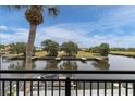 Scenic water view from the balcony overlooking the serene river and boat dock at 432 Moorings Cove Dr. # 432, Tarpon Springs, FL 34689