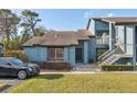 Charming townhouse featuring a well-maintained lawn and neatly trimmed shrubbery at 7546 St Andrews Blvd, Weeki Wachee, FL 34613