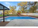 Backyard in-ground pool covered during off-season at 1224 Candlelight Blvd, Brooksville, FL 34601