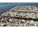 Community aerial view showing the canal-front neighborhood with easy access to the open bay at 13603 Jennita Dr, Hudson, FL 34667