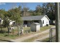 Modest single story home with fenced yard, utility shed and convenient out-building at 148 Husek St, Brooksville, FL 34604