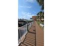 View of a waterfront condo complex showing the dock with boat slips along the building at 5000 Culbreath Key Way # 9-221, Tampa, FL 33611