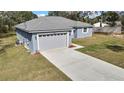 Well-maintained home with a fresh exterior, attached garage, and nicely sized front yard at 7399 Skylark Dr, Spring Hill, FL 34606