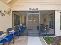 Inviting screened front porch with comfortable seating, perfect for relaxation at 6785 Poinciana Ct, Spring Hill, FL 34606
