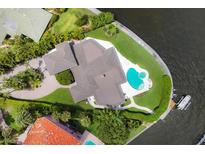 Aerial view of waterfront home with pool and boat dock at 1701 Sandalwood Dr, Sarasota, FL 34231