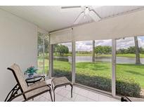 Relaxing sunroom with lake view and comfortable seating at 5519 Fair Oaks St # 2-D, Bradenton, FL 34203