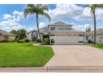 Two-story house with a green trimmed garage and lush lawn at 5706 29Th E Ct, Bradenton, FL 34203