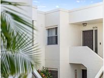 Charming condo entrance with a welcoming dark door, number 5174, and colorful flowers adding a touch of nature at 5174 Marsh Field Ln # 86, Sarasota, FL 34235