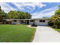 Charming single-story home with a spacious lawn and driveway at 2216 Lee Ln, Sarasota, FL 34231