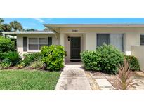 Ranch-style home with landscaped front yard and walkway at 7008 W Country Club N Dr # 139, Sarasota, FL 34243