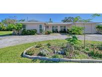 Charming single story home with landscaped yard and driveway at 2488 Breakwater Cir, Sarasota, FL 34231