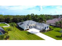 Aerial view of single-story house with pool and landscaped yard at 15923 29Th E St, Parrish, FL 34219