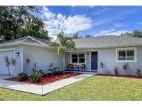 Newly built home with landscaped front yard and attached garage at 3800 Davis Blvd, Sarasota, FL 34232