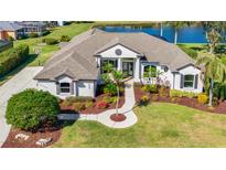 Single-story home with a large backyard, pool, and a three-car garage at 10622 Cheval Pl, Lakewood Ranch, FL 34202