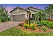 Attractive home with landscaped yard and two-car garage at 6912 Gosport Cv, Lakewood Ranch, FL 34202