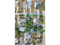 Aerial view of three adjacent lots with existing structures, offering development potential at 2132 Roselawn St, Sarasota, FL 34231