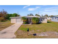 Ranch-style home with carport and fenced yard at 258 Seminole Nw Blvd, Port Charlotte, FL 33952