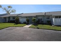 Exterior view of condo showing front entrance, landscaping, and driveway at 4105 33Rd Avenue W Dr # 4105, Bradenton, FL 34205