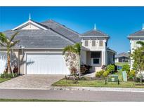 Attractive villa with a two-car garage and well-maintained landscaping at 251 Okeeffe Cir, Bradenton, FL 34212