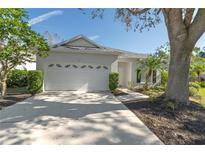 One-story home with attached garage and landscaped yard at 6427 Golden Leaf Ct, Lakewood Ranch, FL 34202