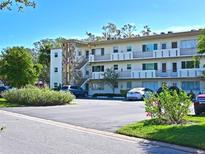 Two-story condo building with parking and landscaping at 4480 Ironwood Cir # 202A, Bradenton, FL 34209