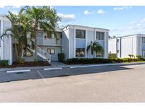 Condo building exterior with parking and landscaping at 5310 26Th W St # 2703, Bradenton, FL 34207