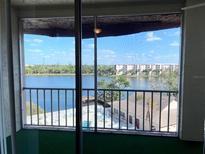 A beautiful screened balcony with great lake views at 3993 Lake Bayshore Dr # F513, Bradenton, FL 34205