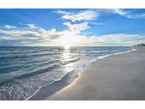 Scenic beach view with calm waves and blue sky at 535 Sanctuary Dr # A202, Longboat Key, FL 34228