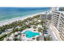 Aerial view of resort-style pool and beach access at 535 Sanctuary Dr # A202, Longboat Key, FL 34228