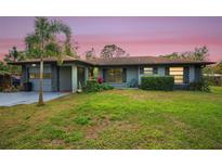 Charming ranch home with landscaped lawn and attached garage at 2204 51St E Blvd, Bradenton, FL 34208