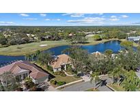 Luxury home on golf course with lake views and lush landscaping at 8128 Collingwood Ct, University Park, FL 34201