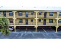 Two-story building with parking and balconies at 14459 River Beach Dr # 112, Port Charlotte, FL 33953