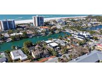 Aerial view of waterfront home with private dock, showcasing its location and proximity to the water at 515 S Washington Dr, Sarasota, FL 34236