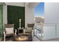 Private balcony with fire pit and city views at 1990 Main St # Ph 6, Sarasota, FL 34236