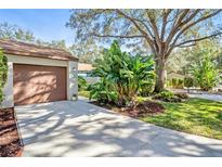 Attached garage with ample storage shelving and workbench at 2915 Oak Ln, Bradenton, FL 34209