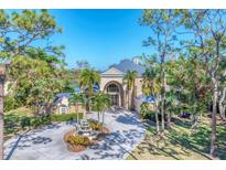 Luxury home with circular driveway and fountain at 6779 Ashley Ct, Sarasota, FL 34241