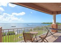 Relaxing balcony boasting stunning water views, hammock, and patio furniture at 2412 Bay Dr W Ave, Bradenton, FL 34207