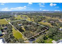 Aerial view showcasing the property's expansive land and surrounding area at 7146 Territory Ln, Sarasota, FL 34240