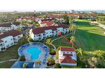 Aerial view showing the community pool, building, and golf course at 6059 Bahia Del Mar Blvd # 239, St Petersburg, FL 33715