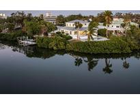 Waterfront property showcasing a beautiful home and private dock at 1718 Bay St, Sarasota, FL 34236