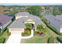 Two-story house with lake view and nicely landscaped yard at 6476 Royal Tern Cir, Lakewood Ranch, FL 34202