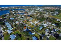 Aerial view showing home location in a residential neighborhood near the water at 315 Palmetto W Rd, Nokomis, FL 34275