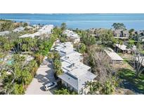 Aerial view of waterfront community with lush landscaping and private driveways at 5310 Gulf Of Mexico Dr # 11, Longboat Key, FL 34228